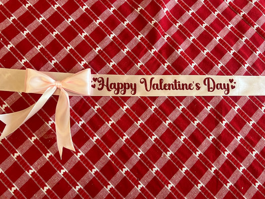 Pink ribbon with red glitter writing