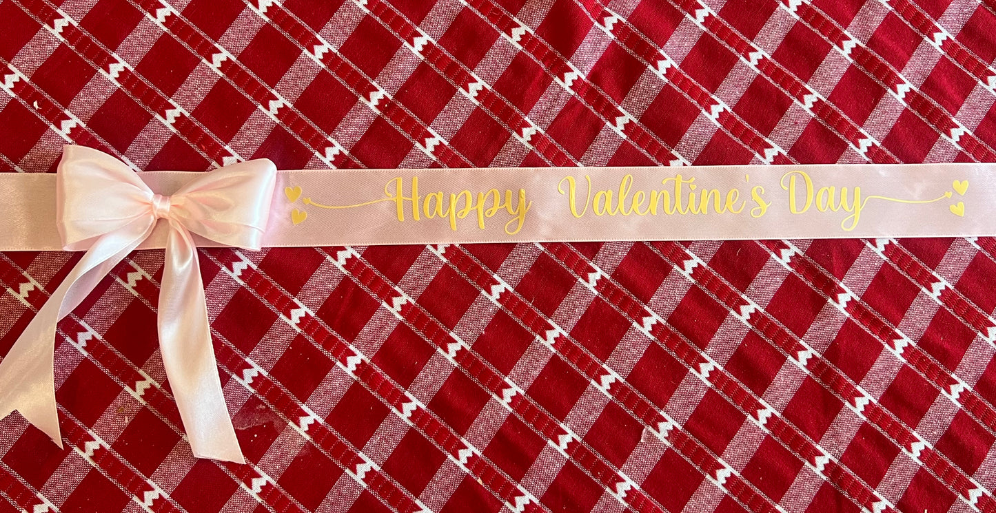 Pink ribbon with gold writing